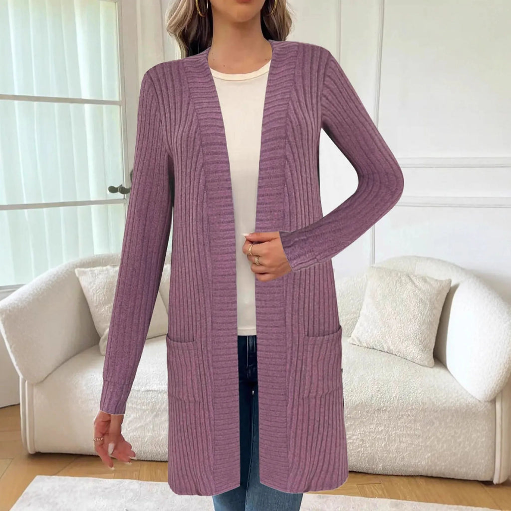 Long sleeve loose fit knitted cardigan jacket in black, shown on a hanger.