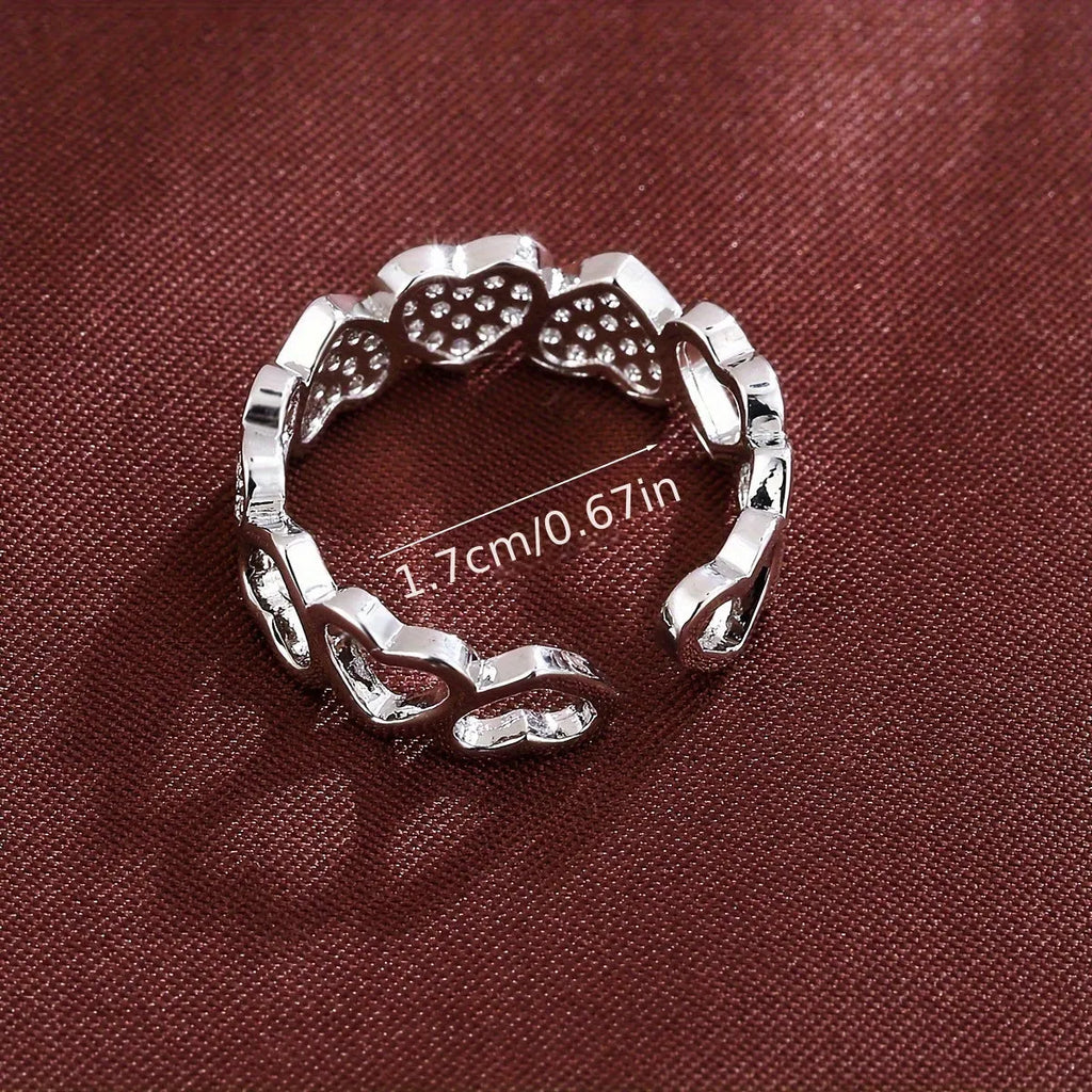 Adjustable geometric copper couple's ring with love heart design in gold or silver colour.