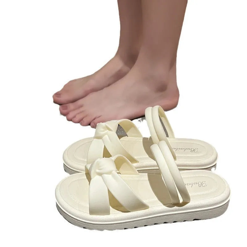 Women's black and white soft back outdoor sandals with flower detail and PVC sole