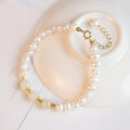 Natural freshwater pearl bracelet with a diamond-shaped electroplated pendant in Hetian jade colour.