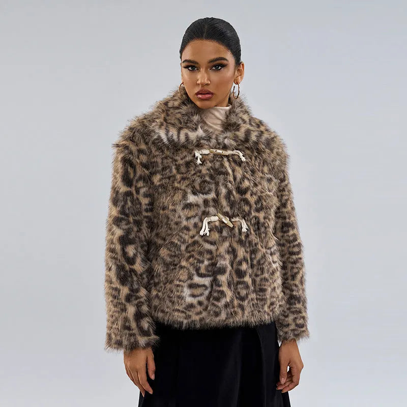 Women's leopard print coat with a buckle lapel fastening on a hanger.