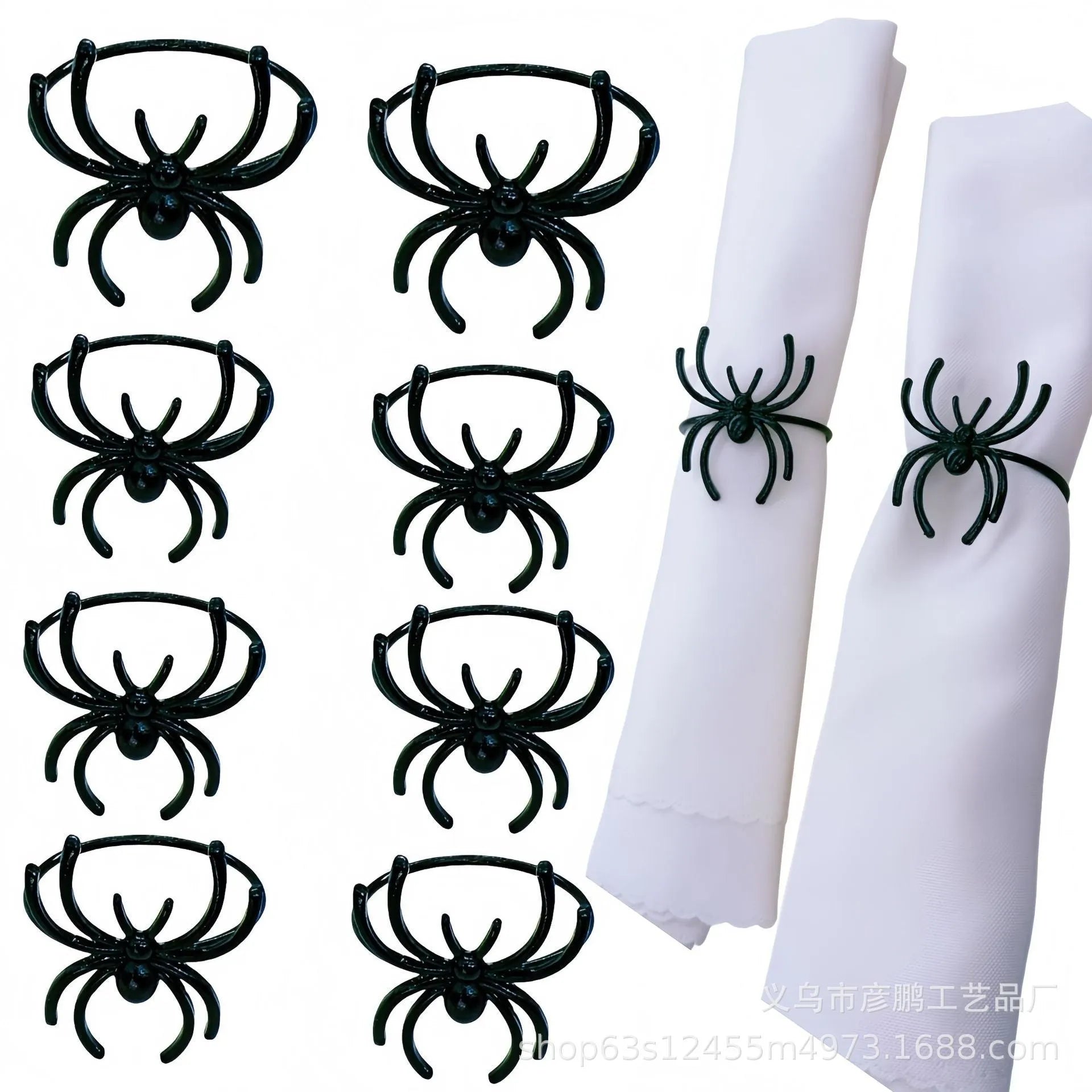 Six black alloy spider-shaped napkin rings for Halloween table decoration on a dark tablecloth.