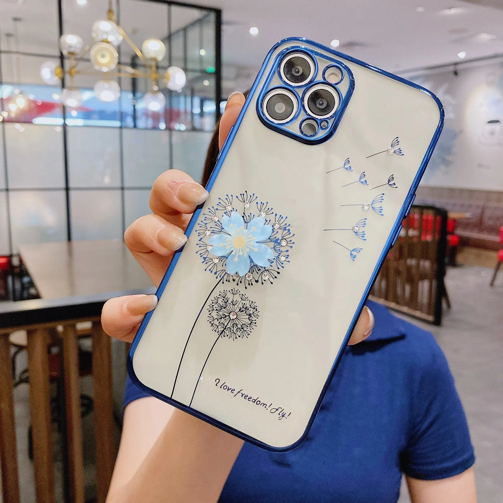 Green iPhone case with 3D white floral design and a silver rotating kickstand extended at the back.