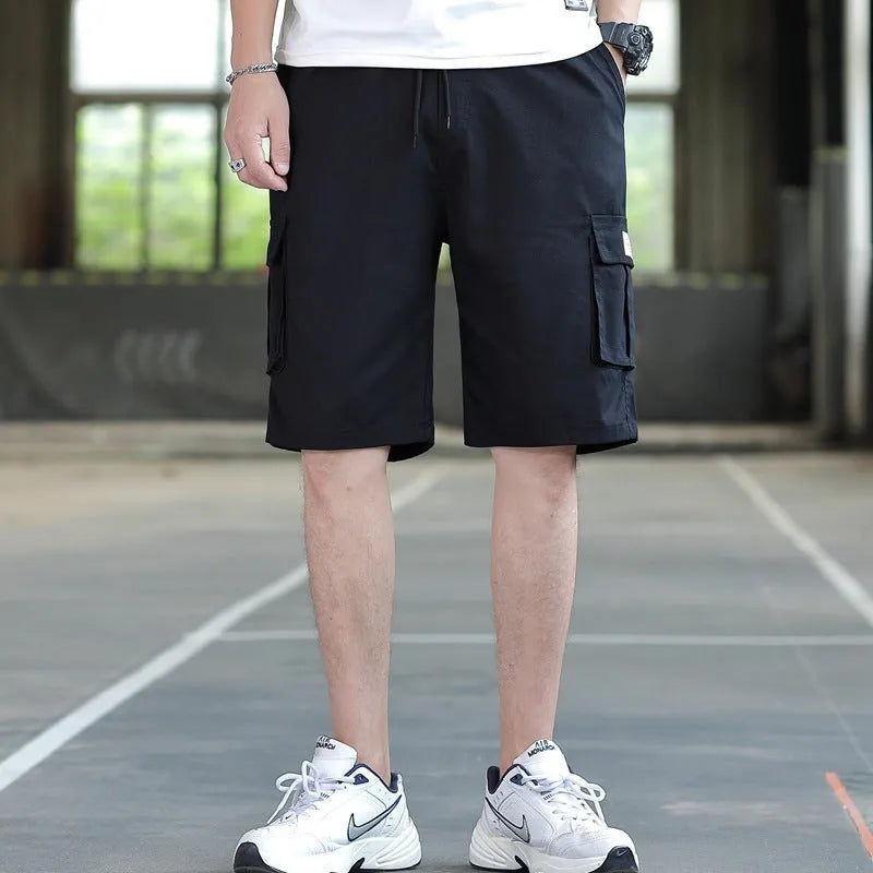 Man modelling loose fit khaki casual trousers with a giraffe pattern gradient detail.