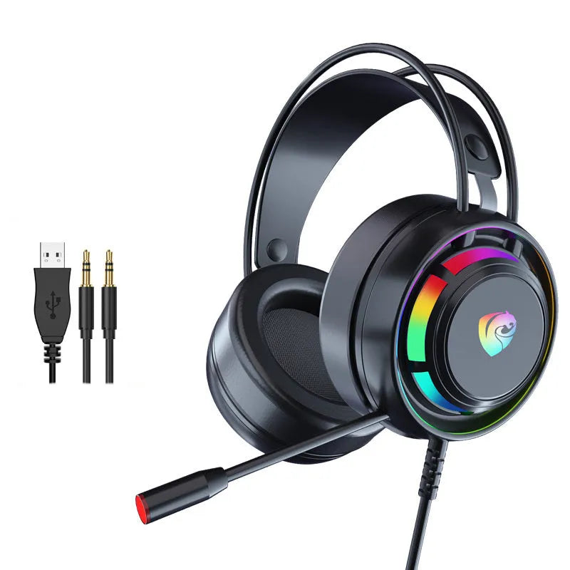 Black wired gaming headset with microphone, adjustable headband, and large circular ear cups on a desk.