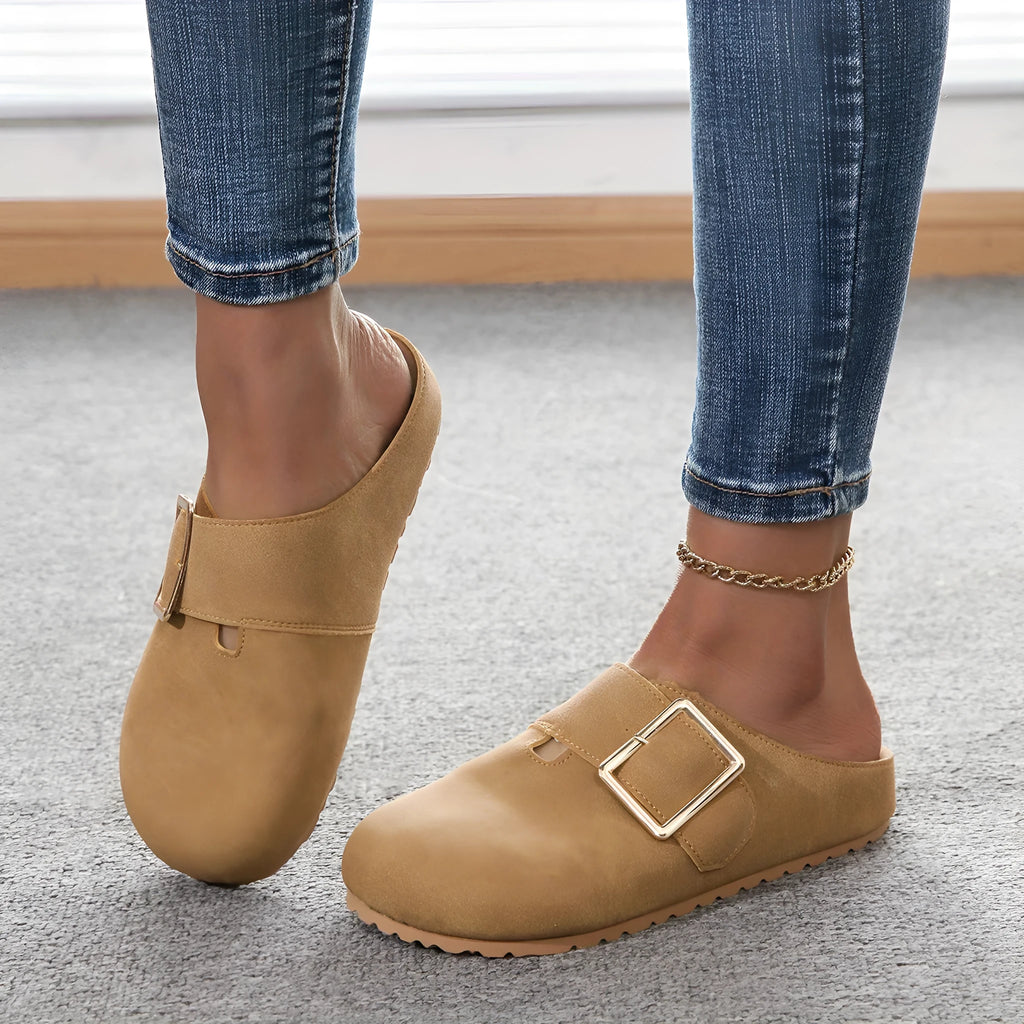 Women's brown canvas slippers with closed toe and low top design