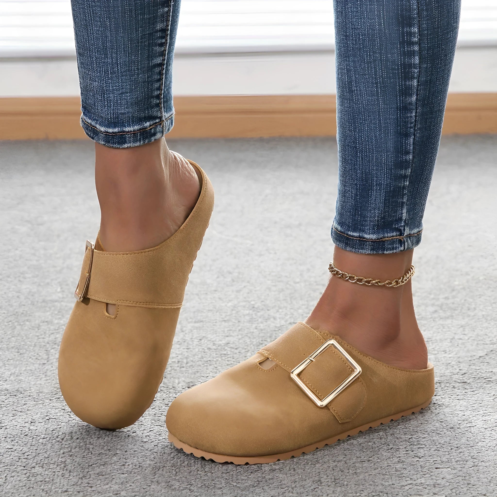 Women's brown canvas slippers with closed toe and low top design