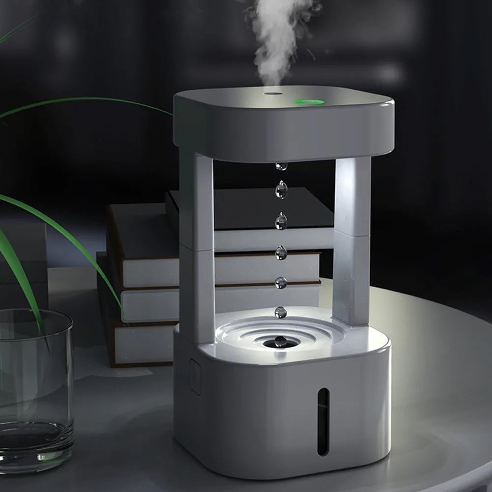 White portable humidifier with anti-gravity water droplet illusion and 580ml transparent tank