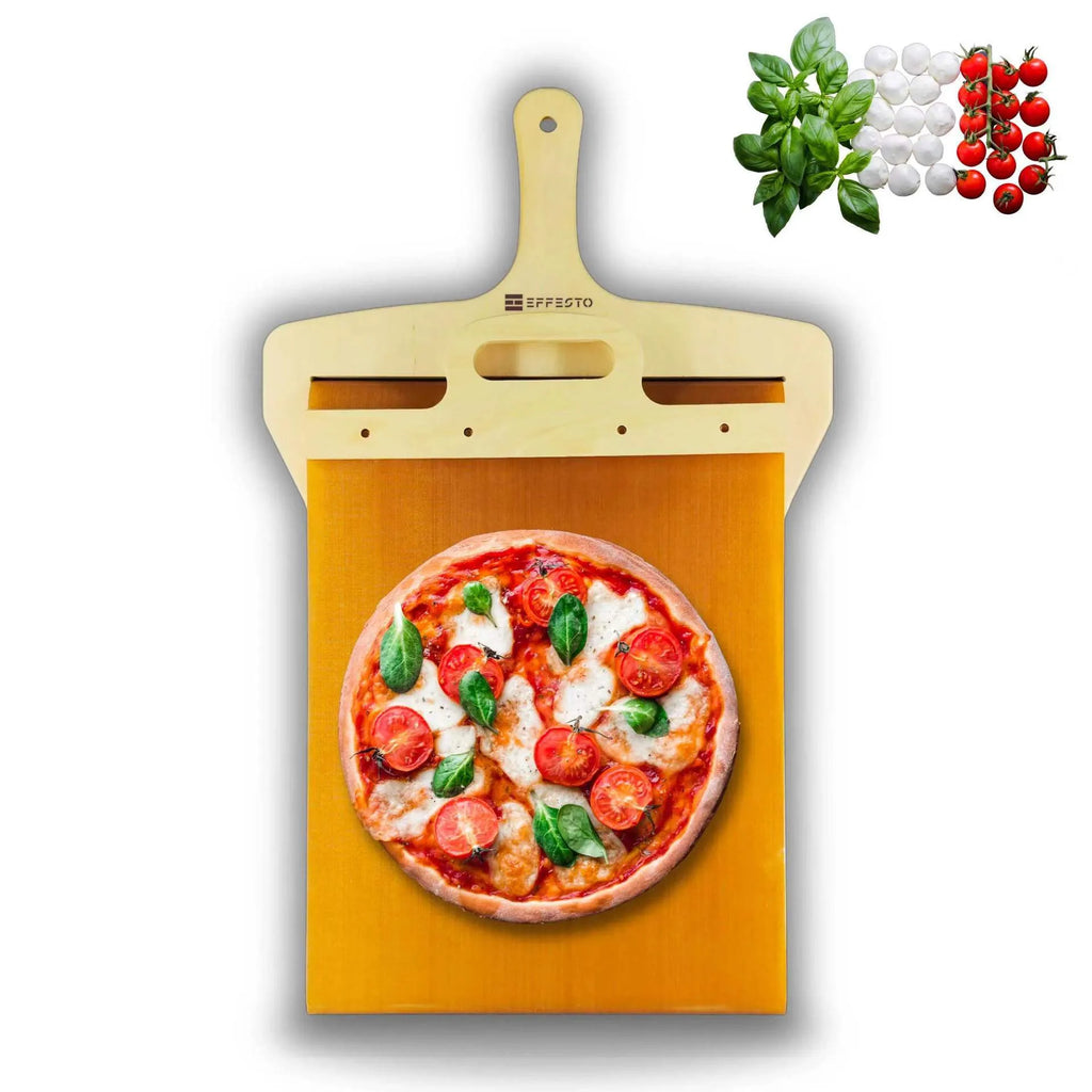 White food-grade PP plastic pizza transfer shovel with a hanging hole, shown on a kitchen counter.
