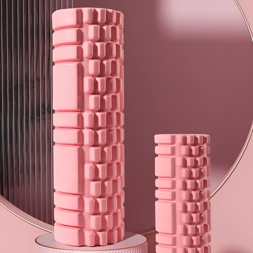 A solid EVA foam roller for fitness, shown in a selection of colours including black, pink, and blue.