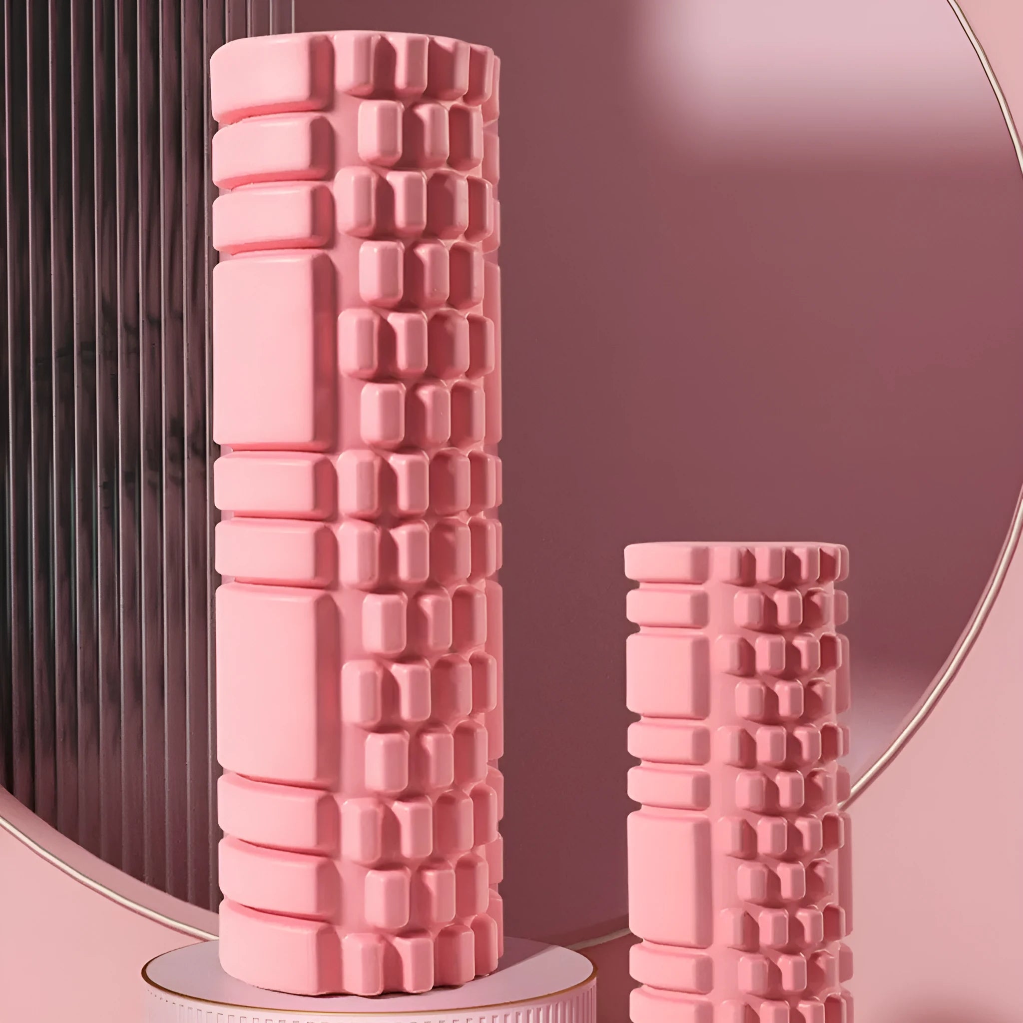 A solid EVA foam roller for fitness, shown in a selection of colours including black, pink, and blue.