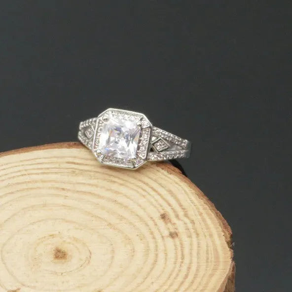 Hollow geometric zircon ring with quadrilateral detailing in platinum colour