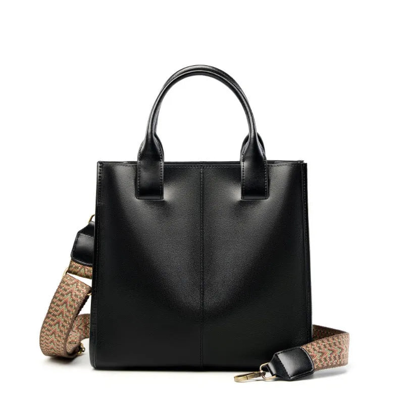 Women's genuine leather shoulder tote bag in black colour showing bucket design and polyester lining
