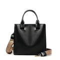 Women's genuine leather shoulder tote bag in black colour showing bucket design and polyester lining
