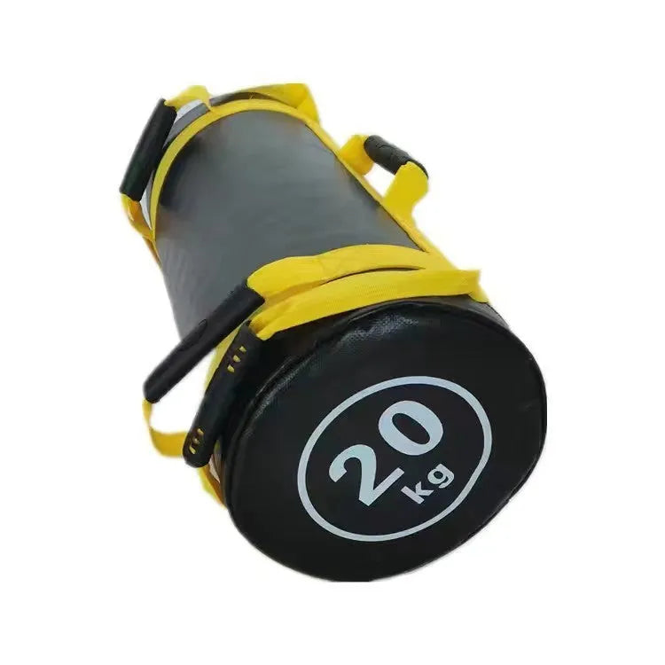 Flat white leather PVC fitness sandbag for weight training on a gym floor.