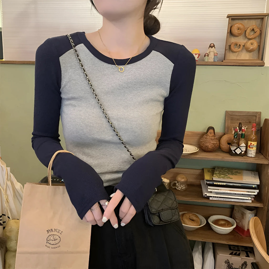 Women's slim fit viscose top with long princess sleeves and embroidery detail in dark blue.