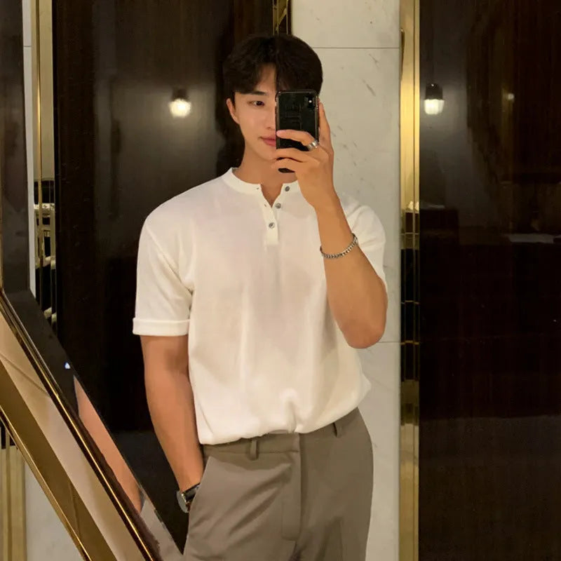 Men's black slim-fit short-sleeved ice silk knitted shirt laid flat, showing pullover style and thin fabric texture