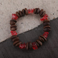 Handmade coffee bean bracelet with 16mm geometric charm showing colour variations