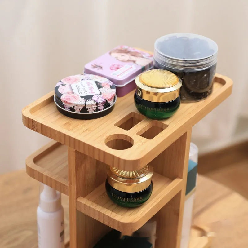 Natural bamboo rotating storage rack with multiple shelves and grid compartments.
