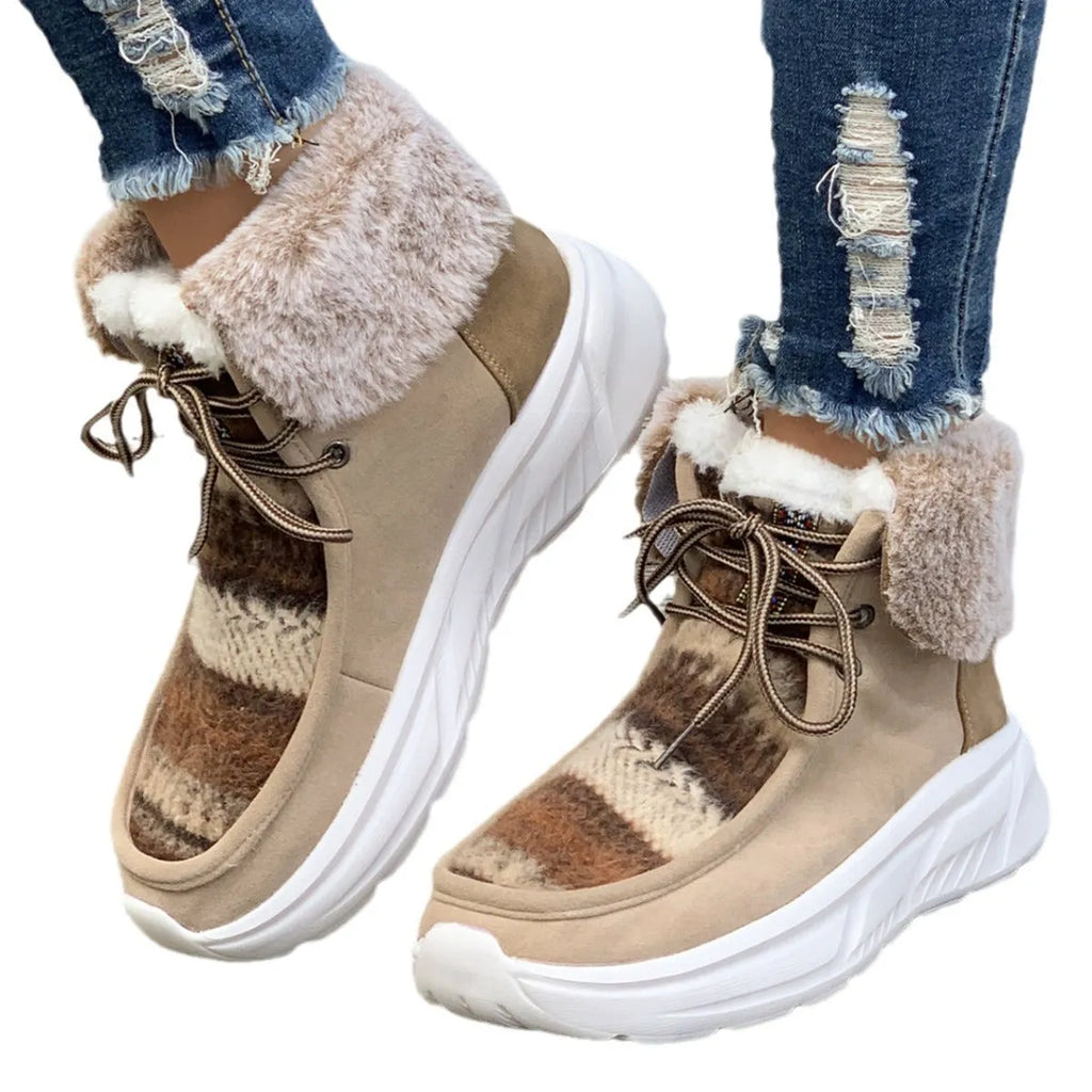 Women's beige lace-up suede snow boots with a thick rubber sole and plush lining, shown from the side.