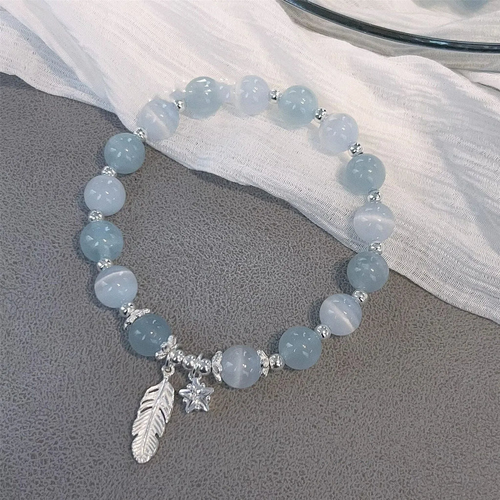 Small white crystal bracelet with blue moonlight colour and star design, Korean-style glass jewellery.