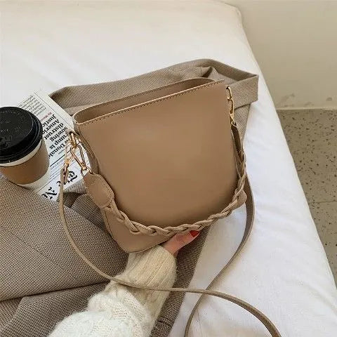 Retro one-shoulder crossbody bucket bag in woven PU material, shown in khaki colour.