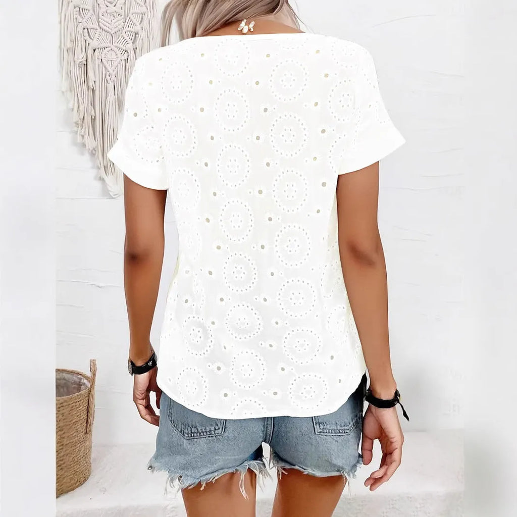 White women's V-neck T-shirt with a textured hollow-out crochet pattern on the front, featuring short sleeves and a loose fit.