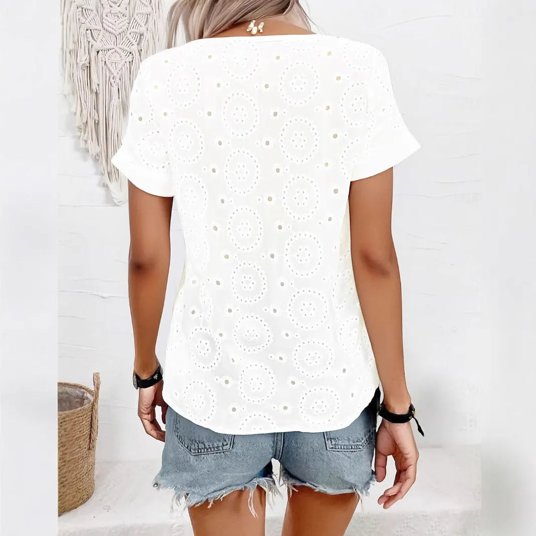 White women's V-neck T-shirt with a textured hollow-out crochet pattern on the front, featuring short sleeves and a loose fit.