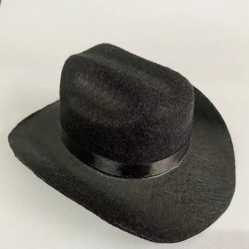 Brown British cowboy hat for a cat on a white background with a black ribbon trim.