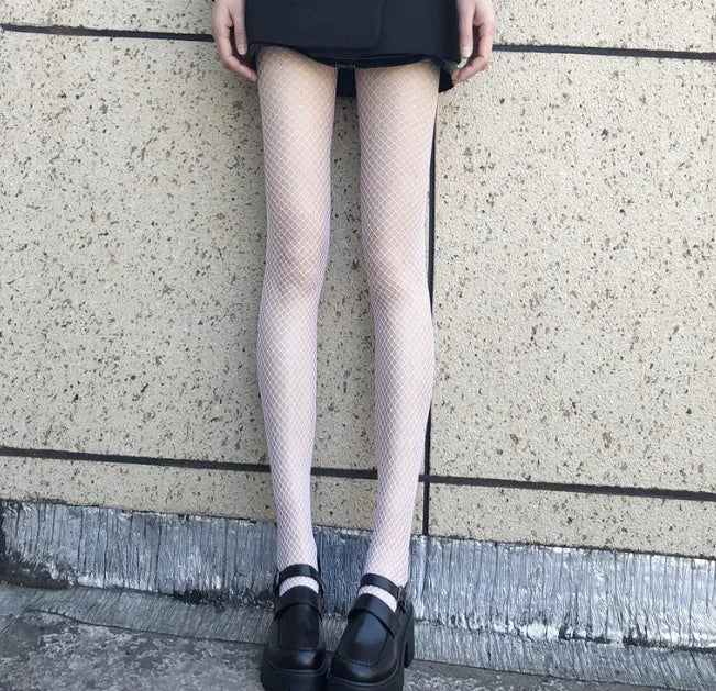 Women's sheer mesh pantyhose showing large, medium, and small mesh patterns in black and white colours.