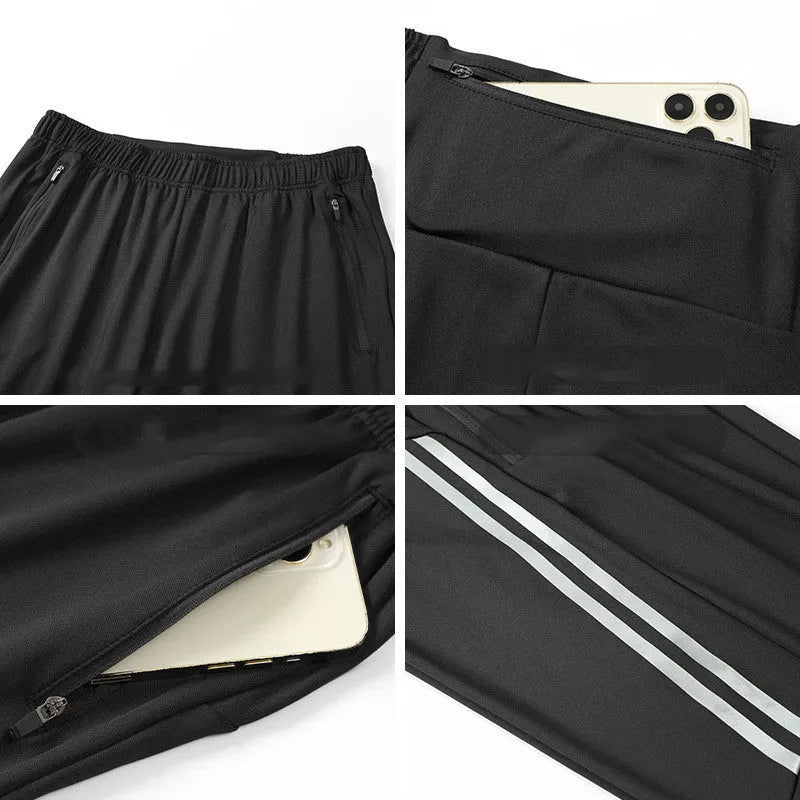Men's black polyester running trousers with mid waist, laid flat.
