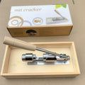 Mechanical walnut cracker with wood handle and aluminium parts, hand-crank design