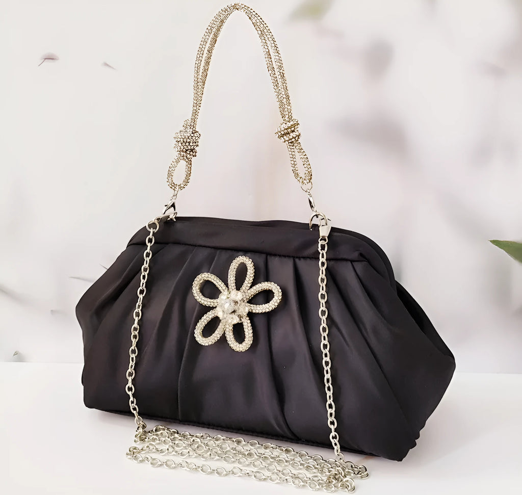 Soft lavender purple women's shoulder messenger bag with chain detail, shown in shell shape with folds.