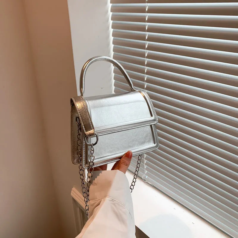 Retro black PU leather crossbody bag with square shape and sewing line details.