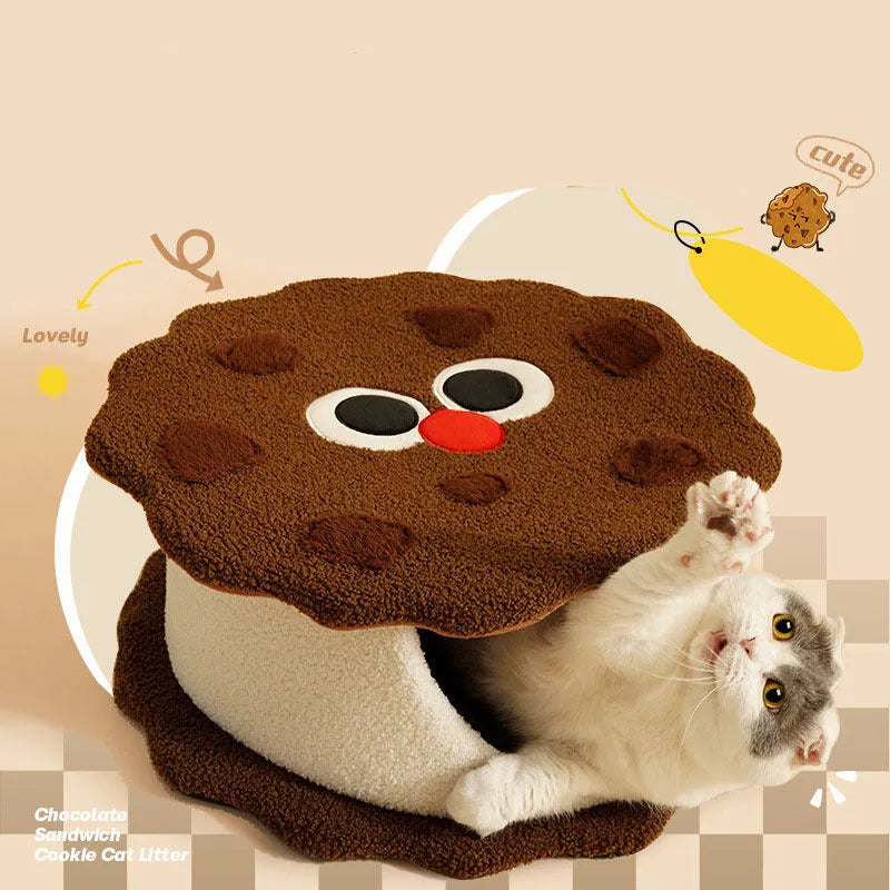 Khaki coloured enclosed cat house shaped like a sandwich cookie nest with a single entry.