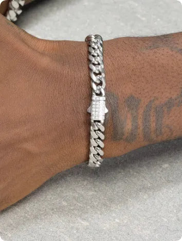 8mm gold titanium steel Cuban bracelet on display with alloy gemstone inlay