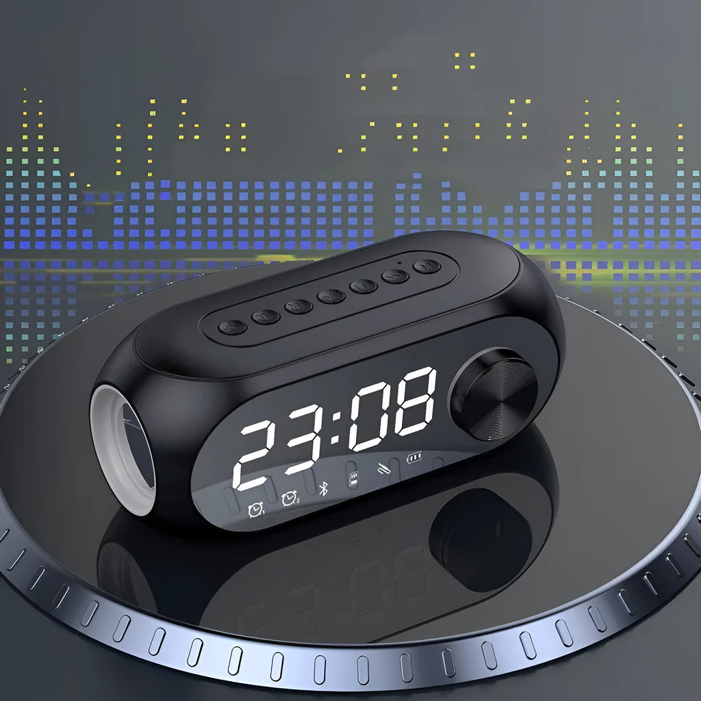S8 Black Extra Bass portable mini USB speaker on a desk next to a laptop.