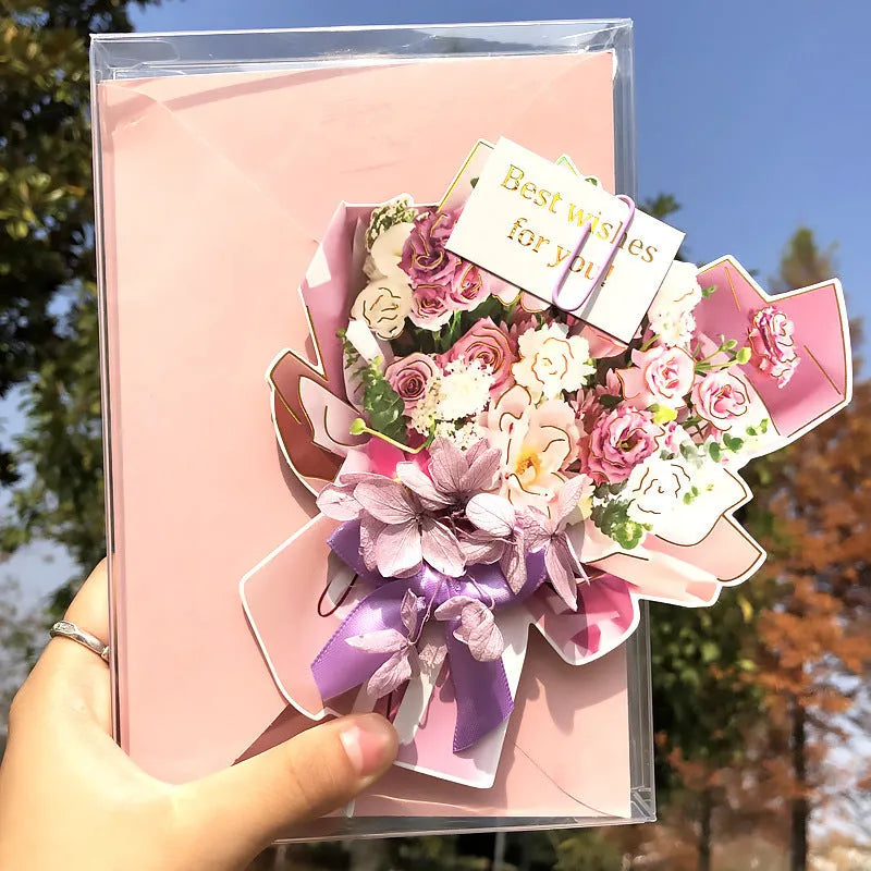 Handmade 3D butterfly birthday greeting card with artificial flowers, shown with its envelope.
