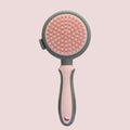 Green and pink two-sided pet brush with retractable slicker brush and silicone octopus-teethed massager