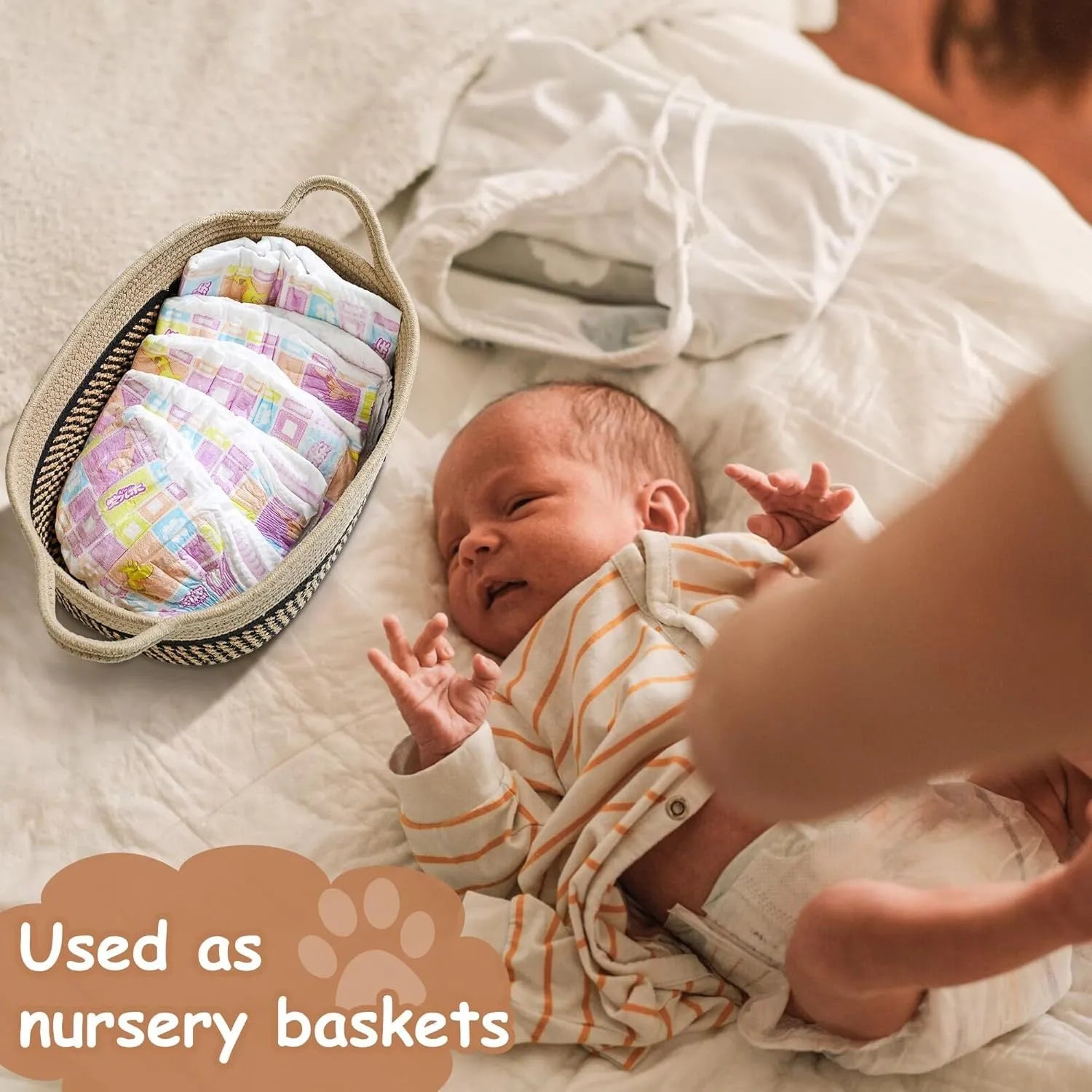 Handwoven light beige cotton rope storage basket with a wooden handle on a table.