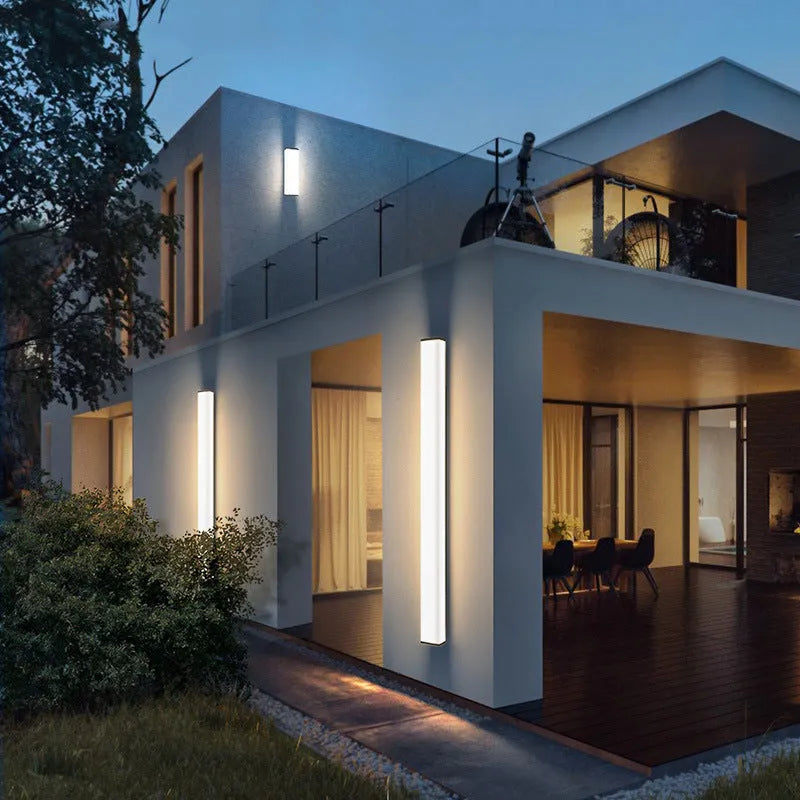 Stainless steel long strip outdoor wall light with LED, mounted on an exterior wall.