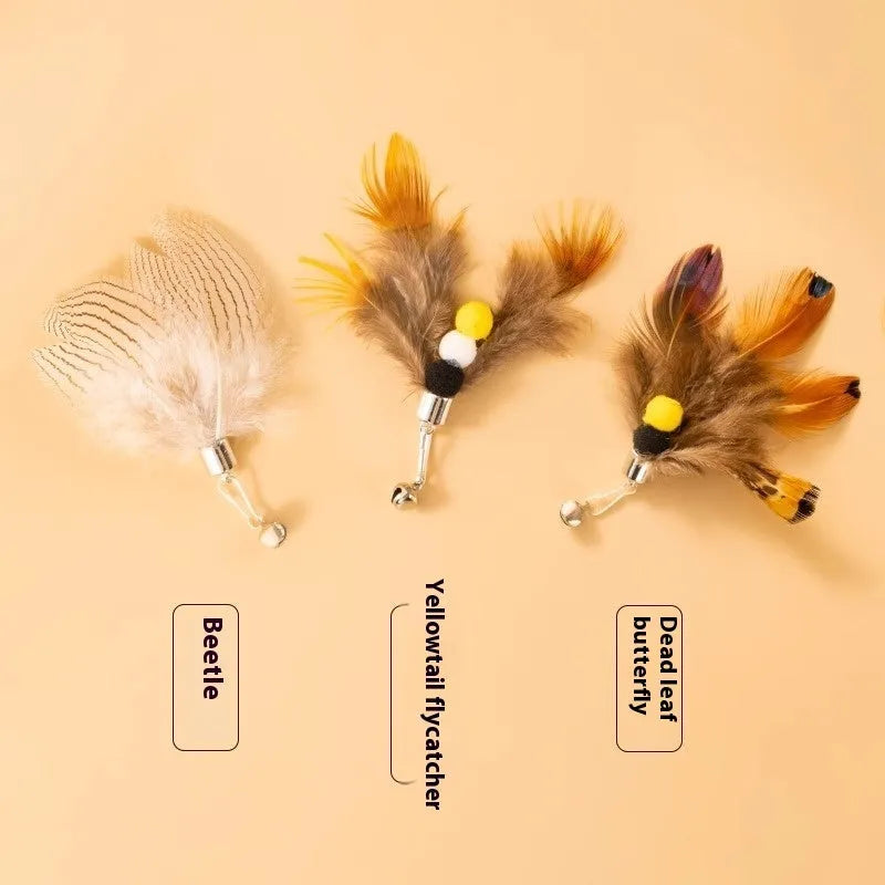 Three steel wire cat toy replacement heads in small flying insect designs on a white background.