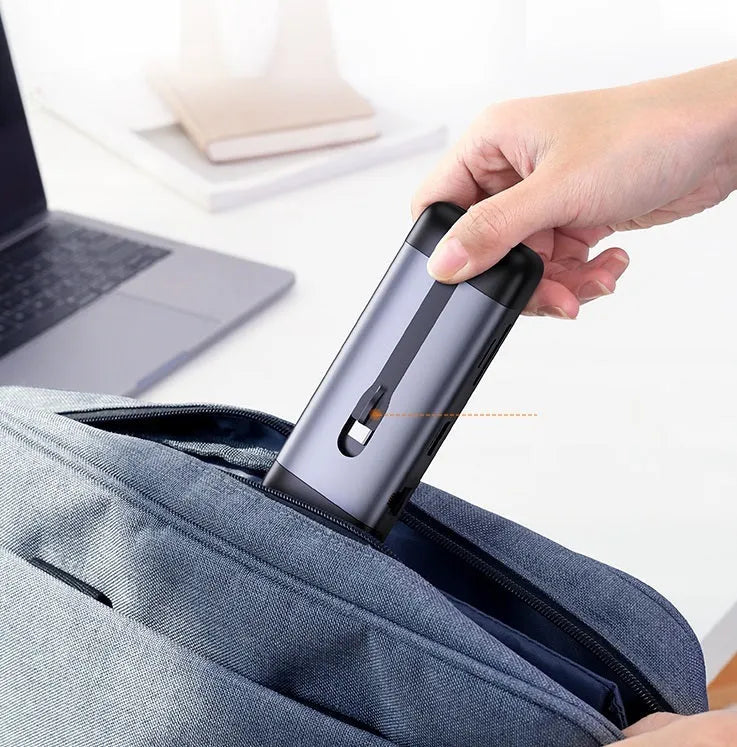 Compact 9-in-1 USB dock adapter with HDMI, VGA, Ethernet, USB 3.0, and card reader ports.