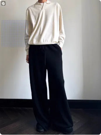 Man's pure wool polo sweater with a lapel collar in loose fit, shown in Milky White colour.