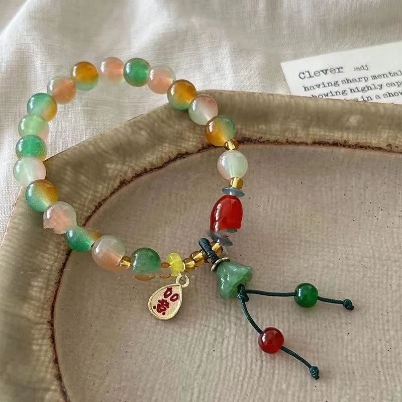 Handcrafted lotus ruyi bracelet with mixed materials and traditional Chinese design
