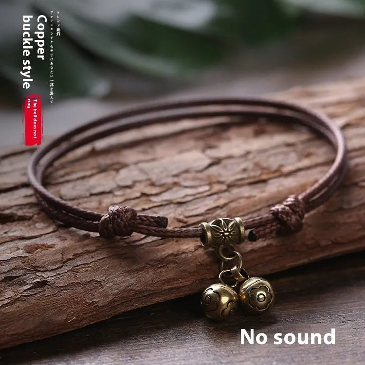 Nylon rope dog collar with brass bell shown in black, red, and coffee colours.