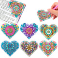 Six handmade PU leather bookmarks with stick-on crystal flowers at the cornerite.