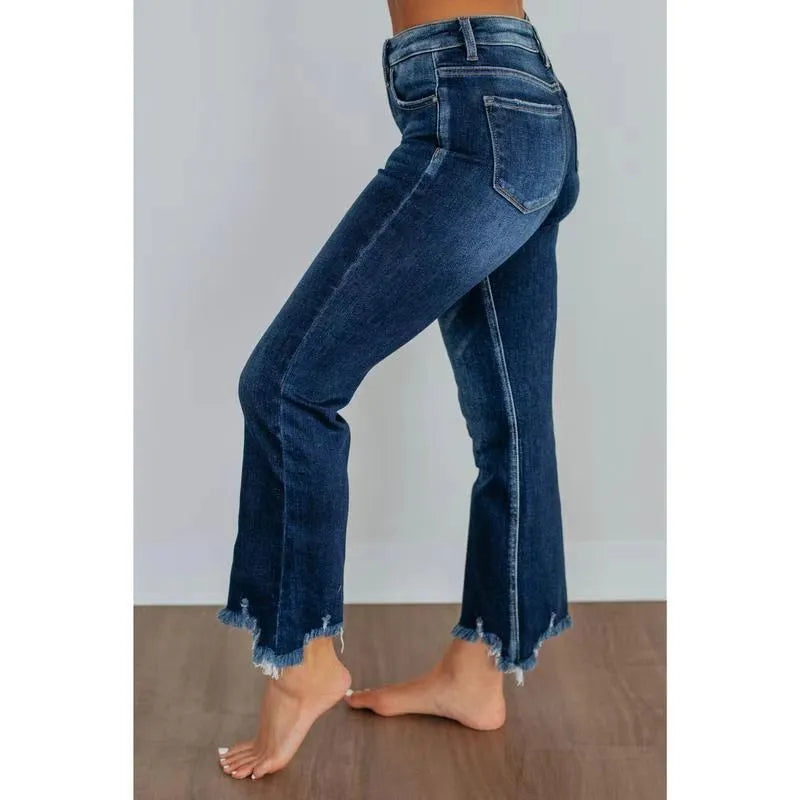Women's solid colour denim pants with hand-worn distressing in dark blue and light blue.