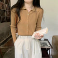 Women's long-sleeved loose fit viscose cardigan top in beige, shown as a layering piece.