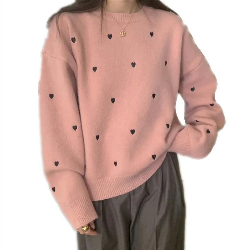 Women's loose acrylic pullover sweater with embroidered love pattern in beige, long sleeves and crew neck.